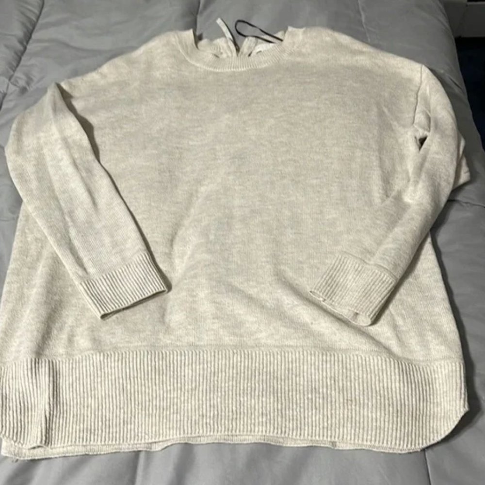 Heathered gray sweater, zipper in back